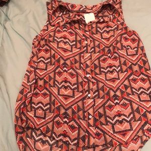 a sheer sleeveless top